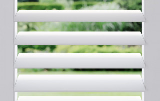 a white blinds on a window